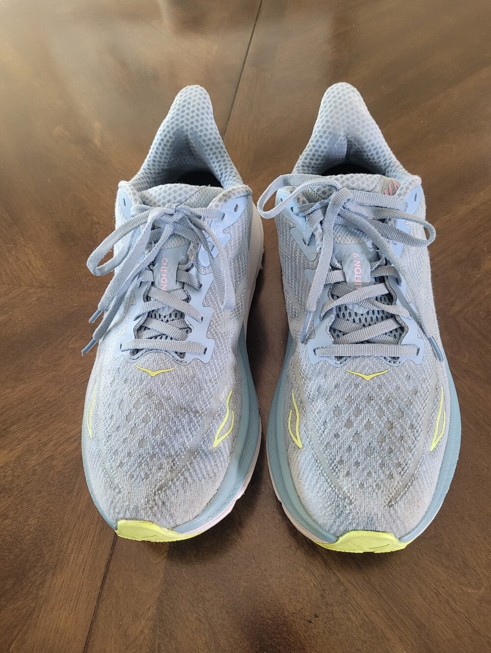Hoka Clifton 9 light Blue Women's Running Sneakers with Yellow Accents.  Size 9D